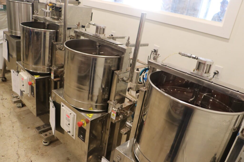 Grinding the beans at Xocolatl